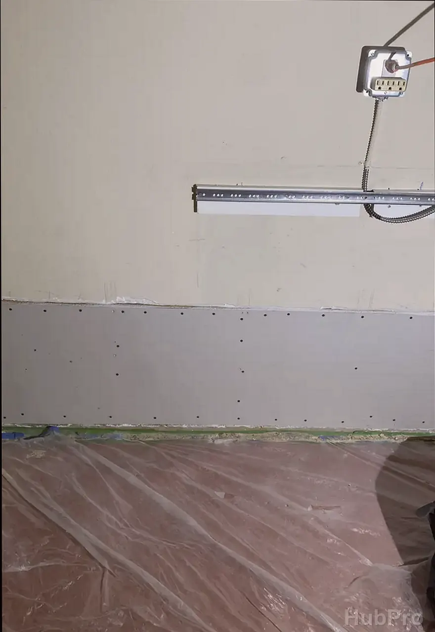 Professional drywall installers in Costa Mesa CA preparing drywall for paint