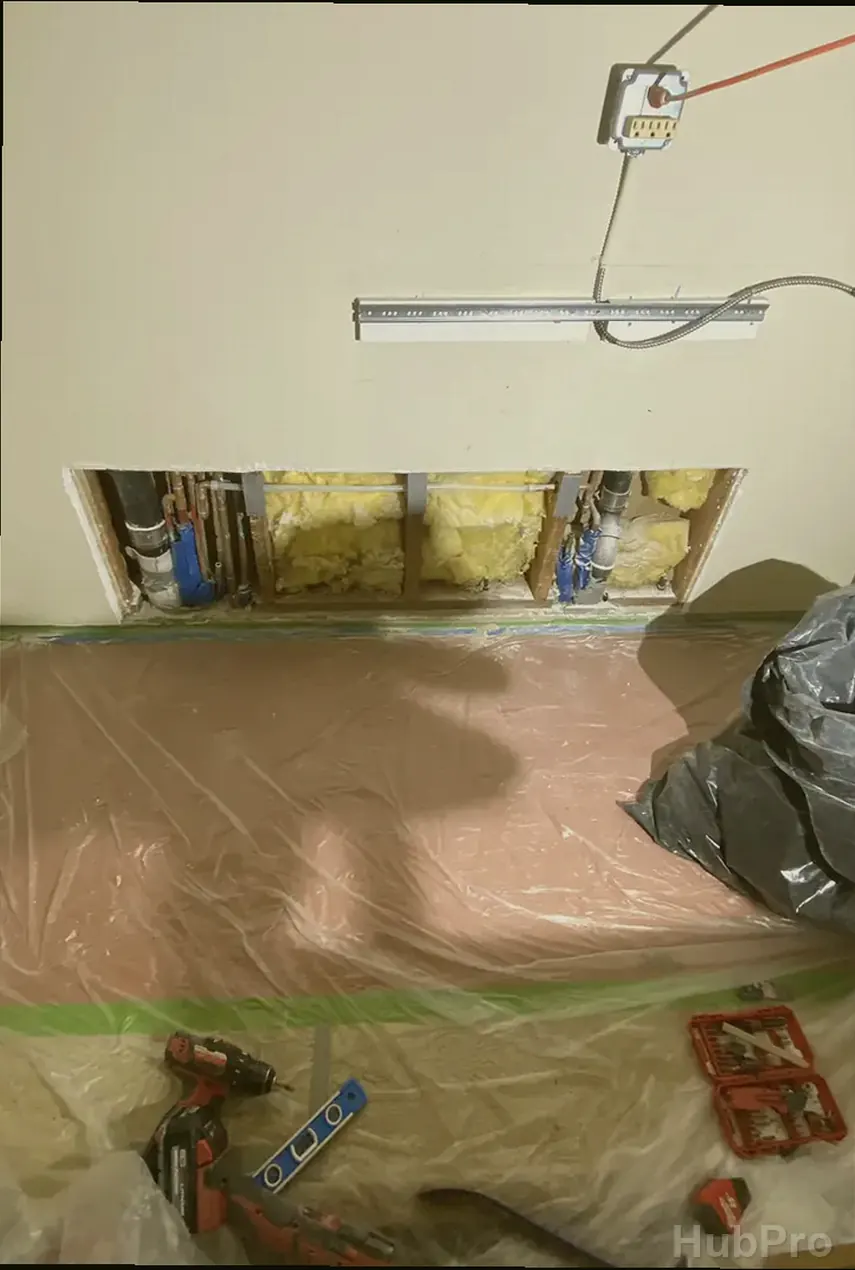 Professional drywall installers in Garden Grove CA preparing drywall for paint