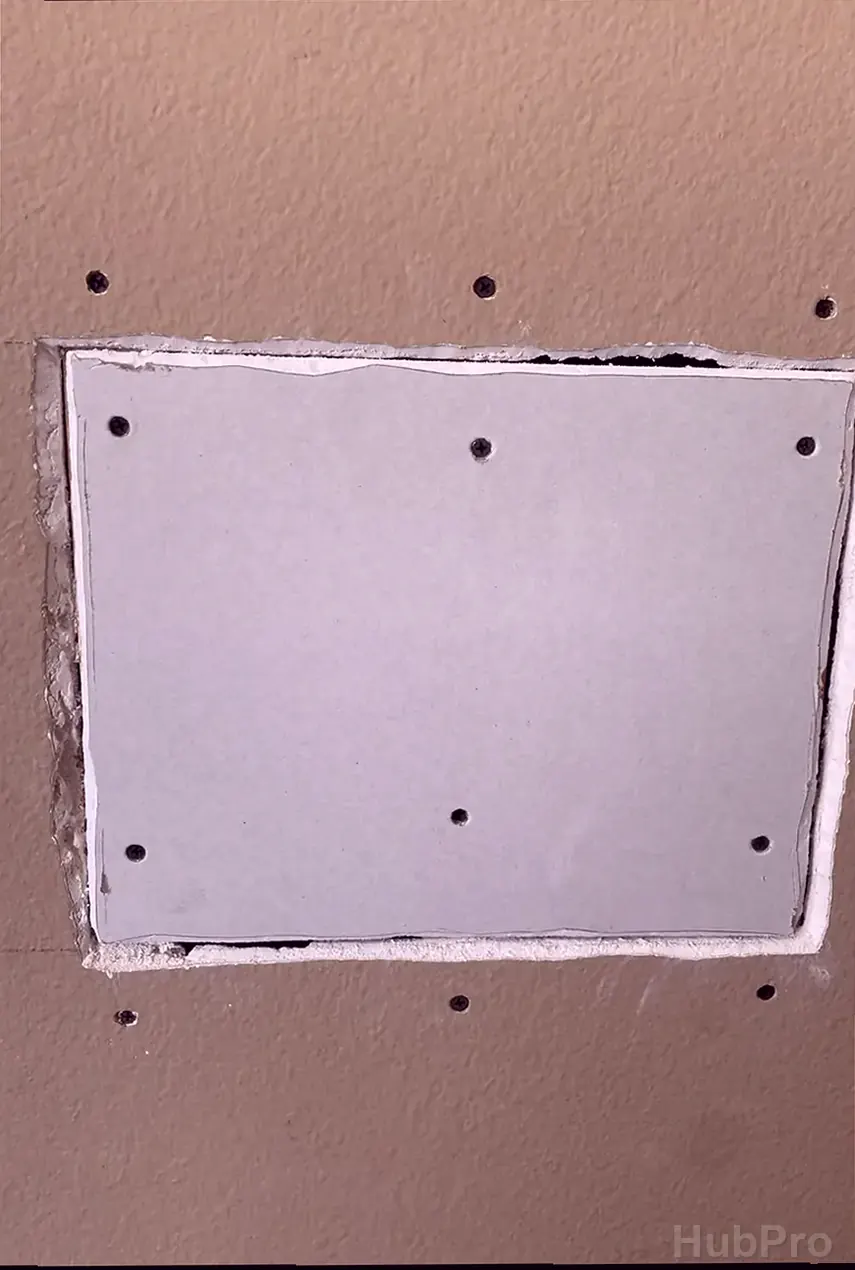 Professional drywall installers in Placentia CA preparing drywall for paint